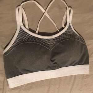 Grey and white Reebok sports bra